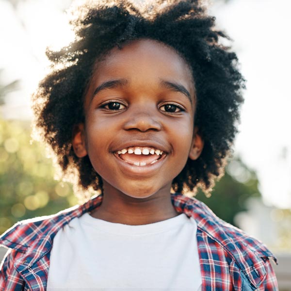 A Happy Boy After Getting Dental Insurance Cover for His Dental Treatment in Pflugerville, TX.