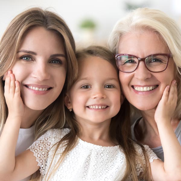 A Happy Little Girl with Mother & Grandma After She Gets Pediatric Dental Care in Pflugerville, TX.
