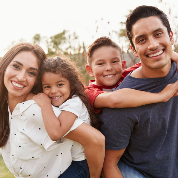 smiling family of four