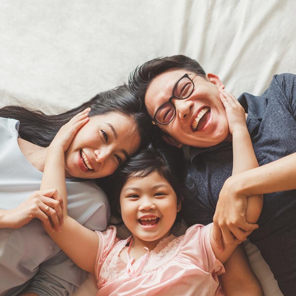 Happy Parents After Their Daughter's Pediatric Dentistry Care in Pflugerville, TX.